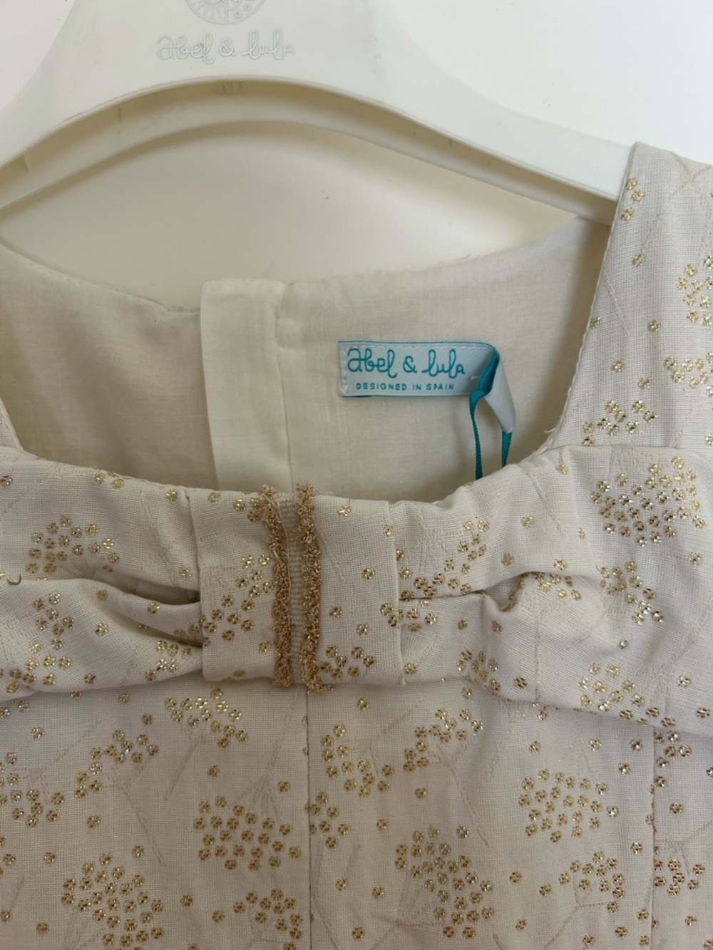 NWT! Abel & Lula Stunning Cream Party Dress with Gold Sparkle Bow. Fully lined - Picture 3 of 6